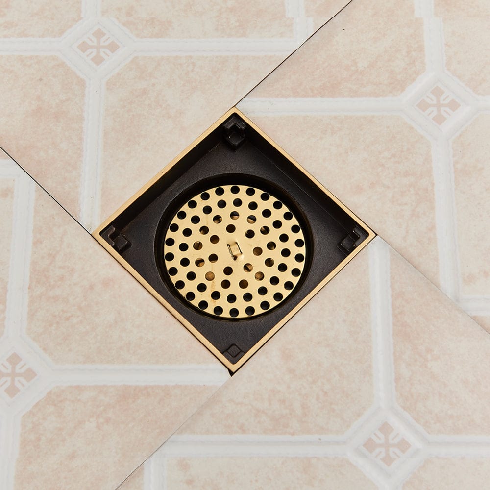 Sifon de pardoseala antimiros, cu iesire verticala, diametru ramă 100 mm, diametru scurgere 38 mm, doua fețe suport fixare placa gresie, auriu nichelat