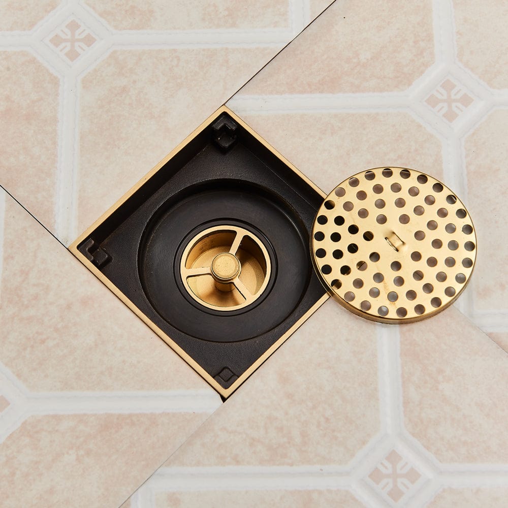 Sifon de pardoseala antimiros, cu iesire verticala, diametru ramă 100 mm, diametru scurgere 38 mm, doua fețe suport fixare placa gresie, auriu nichelat