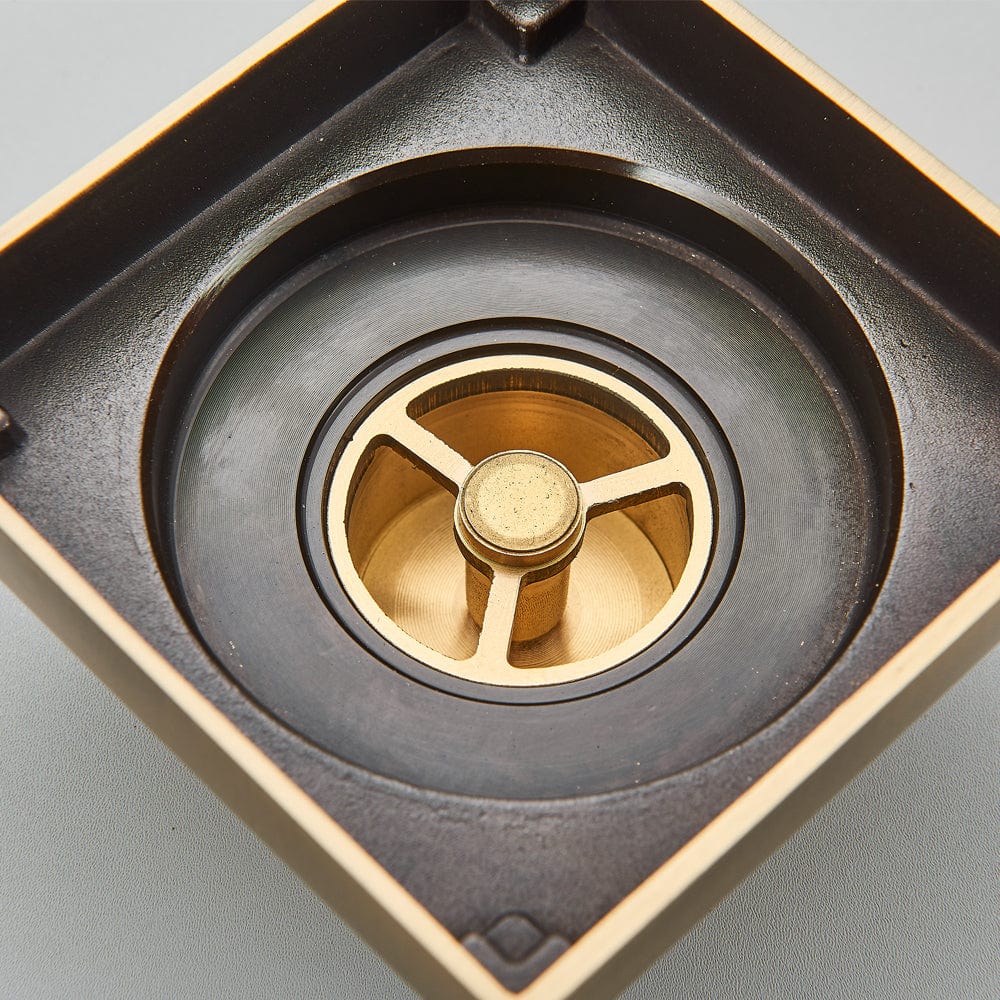 Sifon de pardoseala antimiros, cu iesire verticala, diametru ramă 100 mm, diametru scurgere 38 mm, doua fețe suport fixare placa gresie, auriu nichelat